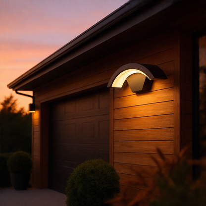 Curved black outdoor wall light on a wood-clad modern facade at dusk