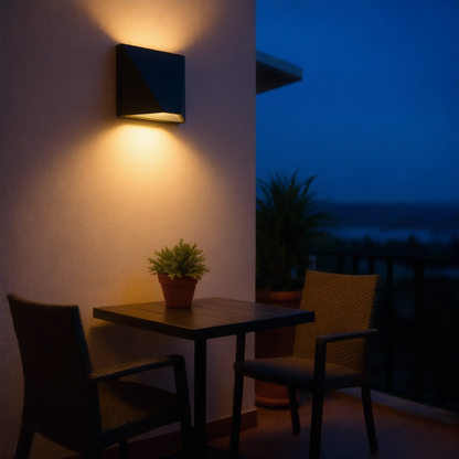 Black minimalist LED wall lamp on a cream balcony wall at blue hour